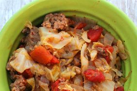 close up view of Ground Beef and Cabbage in a green bowl