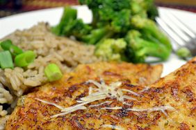 close up view of Parmesan Crusted Tilapia Fillets with rice and broccoli