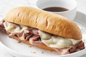 mid angle looking at a french dip sandwich served on a plate