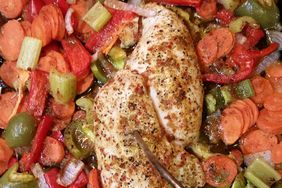 overhead view of Baked Chicken Breasts and Vegetables on a baking sheet