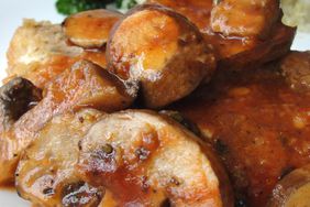 close up view of Chicken in a Pot with mushrooms and sauce