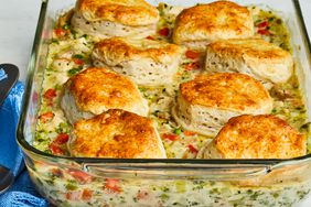 mid-low view of chicken pot pie with a biscuit crust served in a casserole dish
