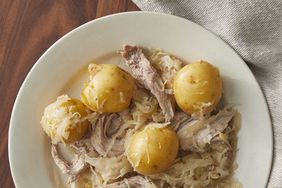 looking down at a shallow bowl of slow cooker pork and sauerkraut