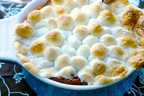 A close up view of easy sweet potato casserole topped with melty marshmallows