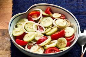 a low angle view of a bowl of Marinated Cucumber Onion Tomato Salad