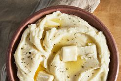 a top-down view of a large bowl of creamy, buttery, basic mashed potatoes