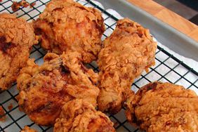 close up view of fried chicken on a cooling rack