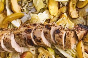close up view of sliced Dijon Pork with Apples and Cabbage on a baking sheet