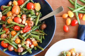 bowl and pot filled with green beans, tomatoes, and potatoes