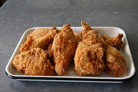 white tray of perfectly fried chicken