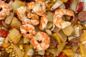 close up view of a Shrimp and Vegetable Sheet Pan, with sausage, potatoes and corn