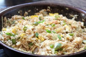 dark ceramic bowl filled with cabbage fried rice