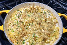 close up view of Campbell's Tuna Noodle Casserole with peas in a yellow pan on the stove