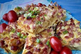 breakfast casserole squares with ham, cheese, and croissant