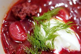 bowl of beet soup with sour cream and dill